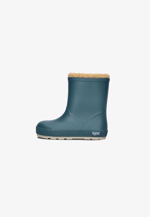 Grüner wasserdichter Gummistiefel mit einem obersten Rand aus hellbraunem Kunstfell, ausgestattet mit einer strukturierten beigefarbenen Gummisohle und einer Markenkennzeichnung an der Seite.