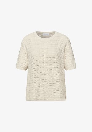 Krémový krátký pletený svetr s krátkými rukávy, vodorovnými průsvitnými pruhy a kulatým výstřihem, zobrazený na bílém pozadí.