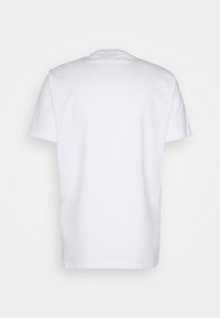 Plain white short-sleeve cotton t-shirt shown from the back on a white background, with a round neckline and regular fit.