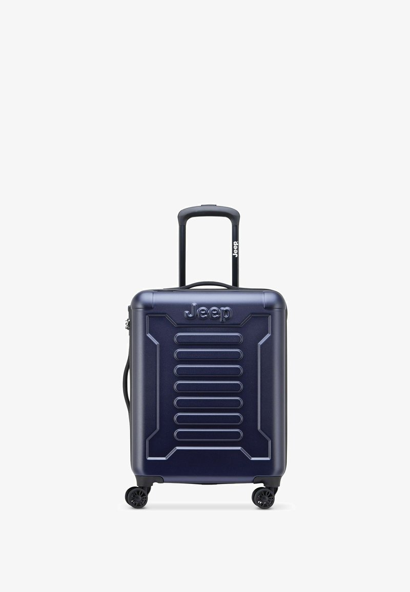 Valigia rigida blu navy con scanalature verticali, logo Jeep, manico telescopico e quattro ruote girevoli nere per una facile manovrabilità.