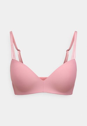 Rosa støpt BH med justerbare, tynne stropper. Jevn tekstur, sømløse cup-er og en v-formet utringning, designet for komfort og støtte.
