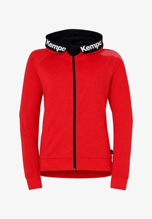 Sweat à capuche rouge zippé avec intérieur de capuche noir et inscription « Kempa » en blanc sur le bord de la capuche, manches longues et coupe ajustée.