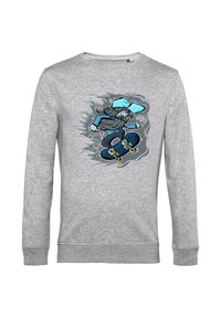 Felpa grigia in cotone con una grafica di un cartone animato di uno skater, con dettagli blu e uno skateboard, su uno sfondo testurizzato.