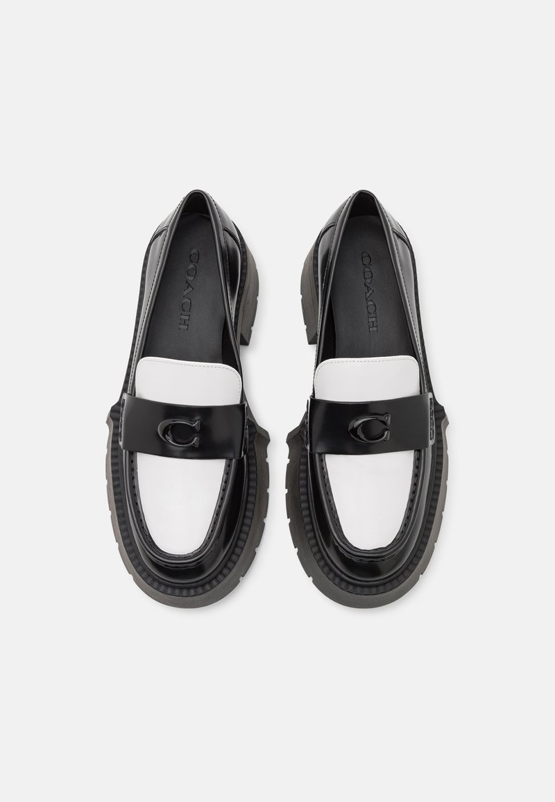 Schwarz-weiße Leder Slipper mit einer massiven Sohle, ausgestattet mit einem auffälligen schwarzen Riemen und Logodetail, glatter Textur und runder Form.