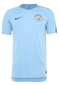 Helles blaues Nike Fußballtrikot mit Rundhalsausschnitt, kurzen Ärmeln und dem Logo von Manchester City auf der Brust. Strukturierten seitliche Akzenten.