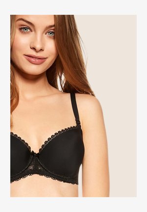 Black underwire bra with lace trim, padded cups, adjustable straps, and a bow accent at the center. Smooth texture and classic design.