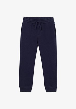 Marineblå børnesweatpants med elastisk talje, snøre, sidelommer og ribstrikkede manchetter på ensfarvet baggrund.