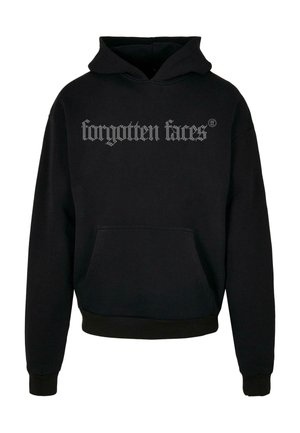 Juoda džinsinė striukė, pagaminta iš medvilnės ir elastano mišinio, su priekinėmis kišenėmis. Krūtinėje yra dekoratyvinis sidabrinis užrašas "pamirštos veido".