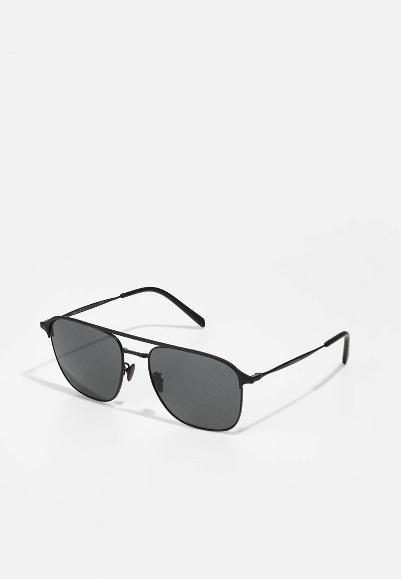 Ochelari de soare negri cu un cadru metalic subțire și elegant. Lentilele sunt gri închis, cu un gradient subtil. Formă hibrid aviator, design minimal.