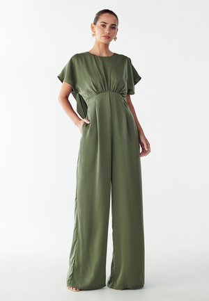 Olive green jumpsuit made of smooth fabric, featuring a round neck, short cap sleeves, and wide-leg pants with a gathered waist.