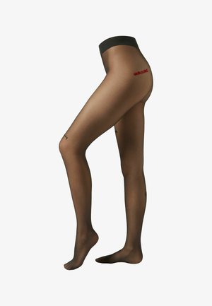 Genomskinliga svarta strumpbyxor med slät yta. Har en bred midjeresår och röd "unboxing"-text på baksidan, med små svarta detaljer på benen.