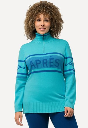Türkisfarbener Reißverschluss-Pullover mit gerippten Bündchen und Saum, featuring ein auffälliges blaues "APRÈS"-Design und geometrische Muster auf der Brust.