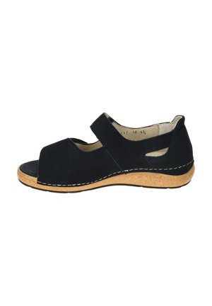 Black open-toe sandal with adjustable strap, cork wedge sole, and side cutouts, shown from the inner side.