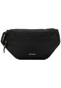 Banane en tissu noir avec deux compartiments zippés, présentant une surface texturée et une étiquette de marque sur le devant.