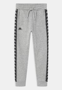 Grå sweatpants med elastisk midja och dragsko. Svarta sidostripes med vitt logomönster. Mjuk tyg, tapered ben design.