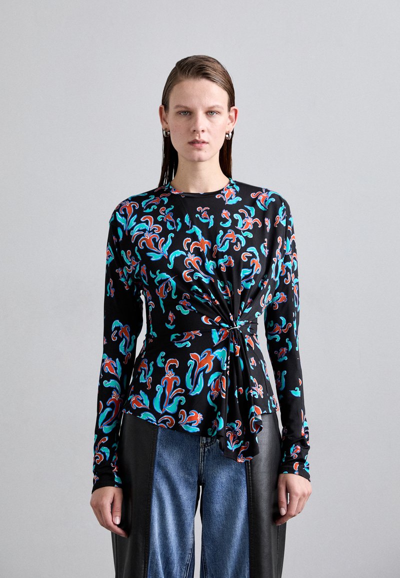 Black long-sleeve top featuring colorful swirling patterns in turquoise, orange, and white. Includes a knotted detail at the waist.