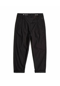 Svarta byxor i slät tyg, med en avslappnad passform, plisserad front, sidofickor och uppvikta fållar. Storlappen visar 32x32.