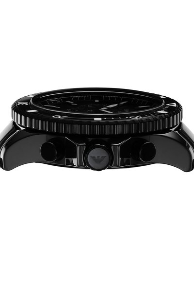 Black analog watch with a sleek rounded case, textured bezel, and contrasting white hour markers. Features two pushers and a logo on the side.