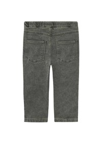 Leggings en denim gris avec une texture douce, taille élastique et deux poches arrière. Le design présente des coutures minimales et une coupe ajustée.