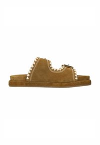 Brown suede slide sandals featuring a cut-out design, white stitching patterns, and a thin sole. Decorative hardware accent near the top.