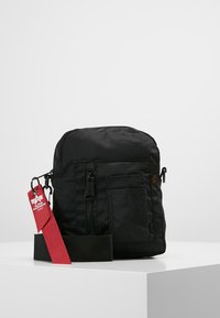 Alpha Industries - CREW CARRY BAG - Axelremsväska - black Miniatyrbild 1