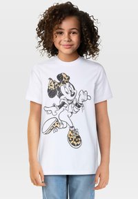 Hvit bomull t-skjorte med et svart og gult leopardmønster av Minnie Mus. Korte ermer og rund halsdesign.