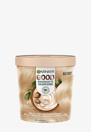 Contenant de couleur de cheveux Garnier, pot rond beige, avec des accents verts, illustration de beurre de cacao, étiqueté Blond Vanille 9.1, végan, sans ammoniaque.