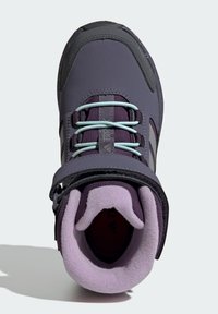 Purple hiking boot with a textured synthetic upper, gray accents, and a padded collar. Features contrasting light blue laces and a secure strap.