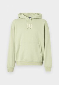 Felpa verde chiaro con cappuccio, realizzata in tessuto morbido, dotata di una tasca frontale e del logo bianco "GAP". Polsini e orlo a coste.