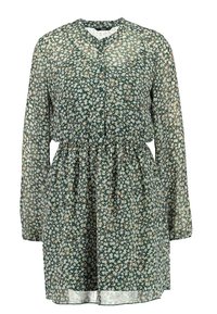 Vihreä kukkamekko, jossa on napitettu edusta, pitkät hihat, vyötärö rypytetty ja kevyt, läpikuultava kangas, jossa on pieniä valkoisia ja beigejä kukkia.