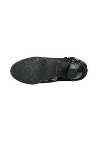 Scarpa nera con motivo floreale, superiore testurizzato, suola in gomma nera solida con decorazioni in rilievo e tacco arrotondato. Taglia 37 indicata.