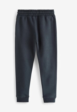 Pantalones de chándal gris oscuro con cinturilla elástica, piernas ajustadas y puños acanalados, fabricados en un tejido suave y texturizado. Sin patrones visibles.