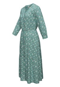 Floral maxi dress in teal with long sleeves, cinched waist, and tiered skirt. Features white and pink flower patterns throughout.