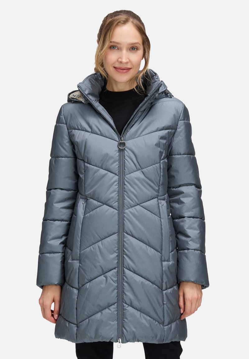 Padded gray coat with a zippered front, hood, and chevron stitching. Features side pockets and a mid-thigh length design. Smooth texture.
