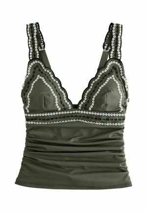 Olive green tank top with scalloped edges, white and black circular trim, ruched fabric below the bust, and wide shoulder straps.