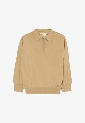 Beżowy sweter z długim rękawem, kołnierzem i krótkim zamkiem z przodu, z prążkowanymi mankietami i dołem oraz małym, okrągłym metalowym logo blisko dołu.
