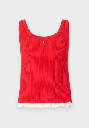 Sarkans ribots bezroku tops ar apaļu kakla izgriezumu un baltu mežģīņu maliņu apakšējā malā, centrā neliels zelta emblemāts.