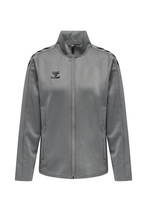 Veste de sport grise zippée intégrale avec col haut, poches latérales, bandes chevron noires sur les épaules et logo hummel sur la poitrine.
