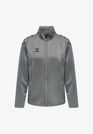 Veste de sport grise zippée intégrale avec col haut, poches latérales, bandes chevron noires sur les épaules et logo hummel sur la poitrine.