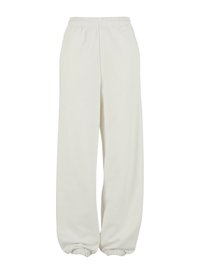 Cremefarvede sweatpants med elastisk talje og elastiske manchetter, der har en afslappet pasform og blød tekstur.
