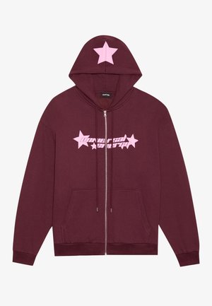 Burgundy zip-up hoodie with a pink star on the hood and front. Features drawstrings, front pockets, and graphic text in pink. Soft texture.
