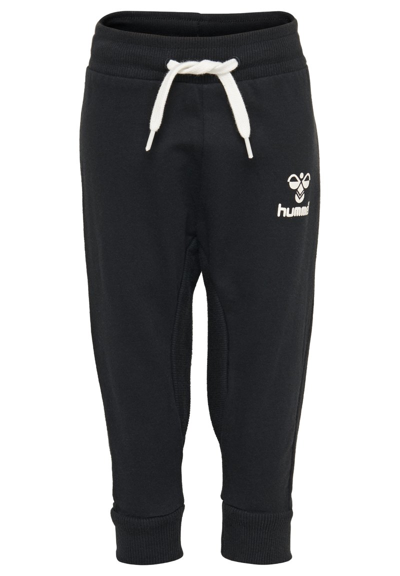 Pantalons de survêtement noirs avec des poignets côtelés et une ceinture élastique. Comprend un cordon blanc et un petit logo blanc sur la cuisse.