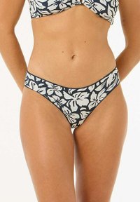 Bikini-Unterteil mit navyblauem Grundton und weißem Blumenmuster, aus strukturiertem Material mit teilweise geripptem Design.