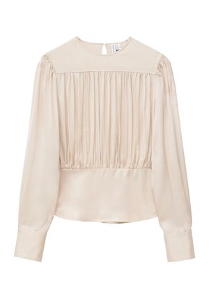 Beige long-sleeve blouse with gathered front detailing, round neckline, button closure at back, and wide cuffs.