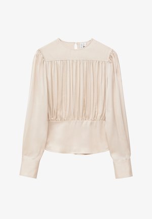 Beige Bluse mit langen Ärmeln, gerafftem Vorderteil, rundem Ausschnitt, Knopfverschluss hinten und breiten Manschetten.