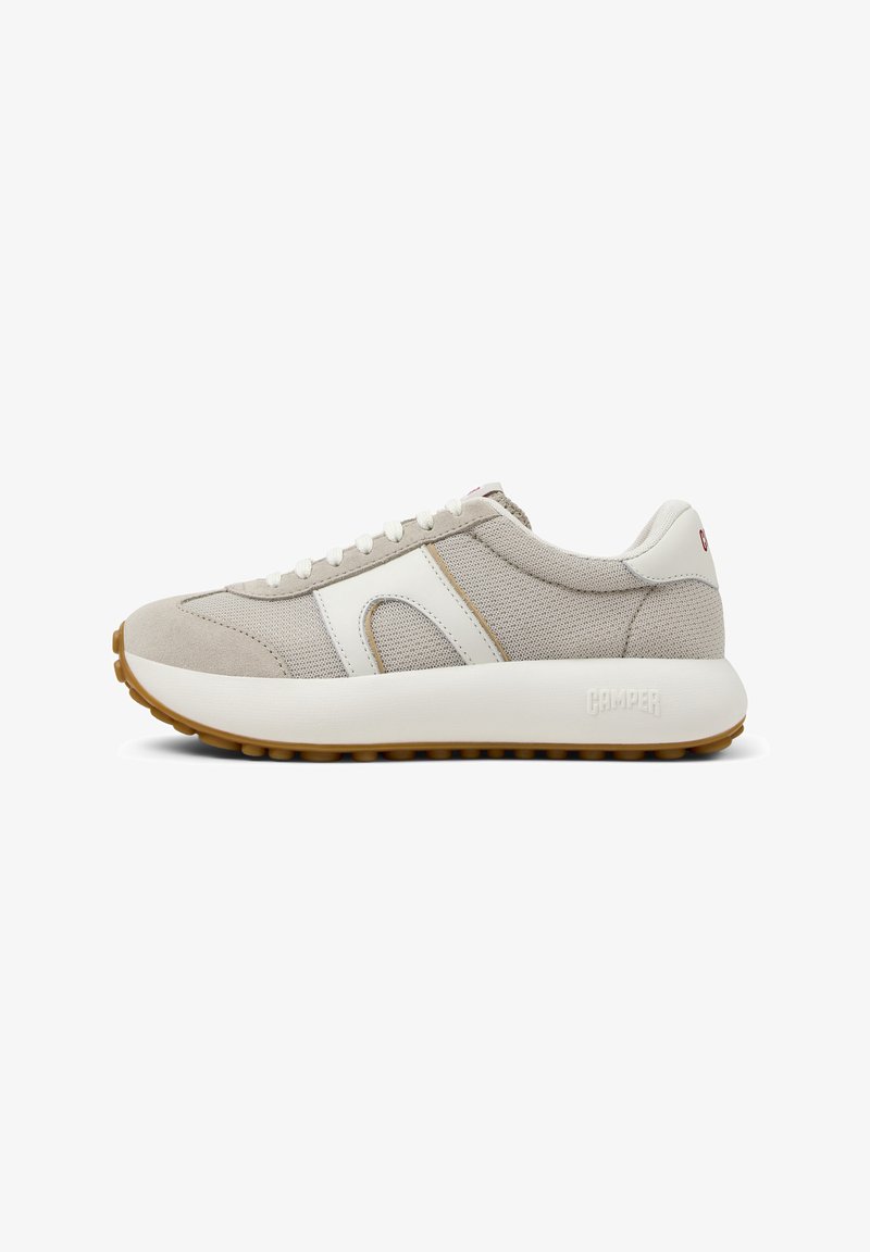 Beige sneaker featuring mesh and suede materials, white accents, round laces, thick sole with textured grip, and "CAMper" branding on the heel.