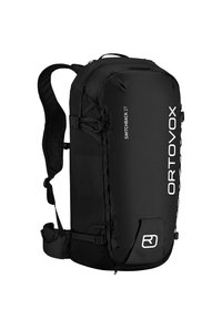 Black backpack with textured side panels, adjustable straps, and white logo; features multiple attachment points and a secure top closure.
