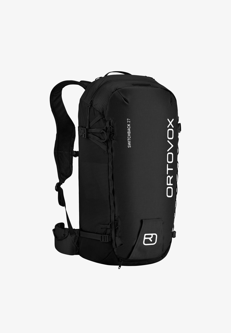 Black backpack with textured side panels, adjustable straps, and white logo; features multiple attachment points and a secure top closure.