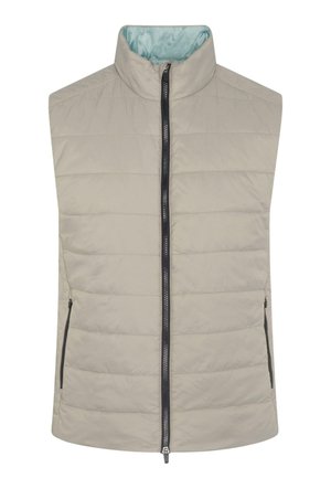 Gaiši beigtu bez piedurknēm veste ar quilted dizainu, augstu apkakli, pilnu priekšējā rāvējslēdzēju un divām kabatām ar rāvējslēdzējiem sānos. Iekšpusē izklāta ar gaiši zilu audumu.