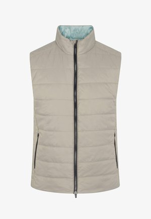 Gaiši beigtu bez piedurknēm veste ar quilted dizainu, augstu apkakli, pilnu priekšējā rāvējslēdzēju un divām kabatām ar rāvējslēdzējiem sānos. Iekšpusē izklāta ar gaiši zilu audumu.